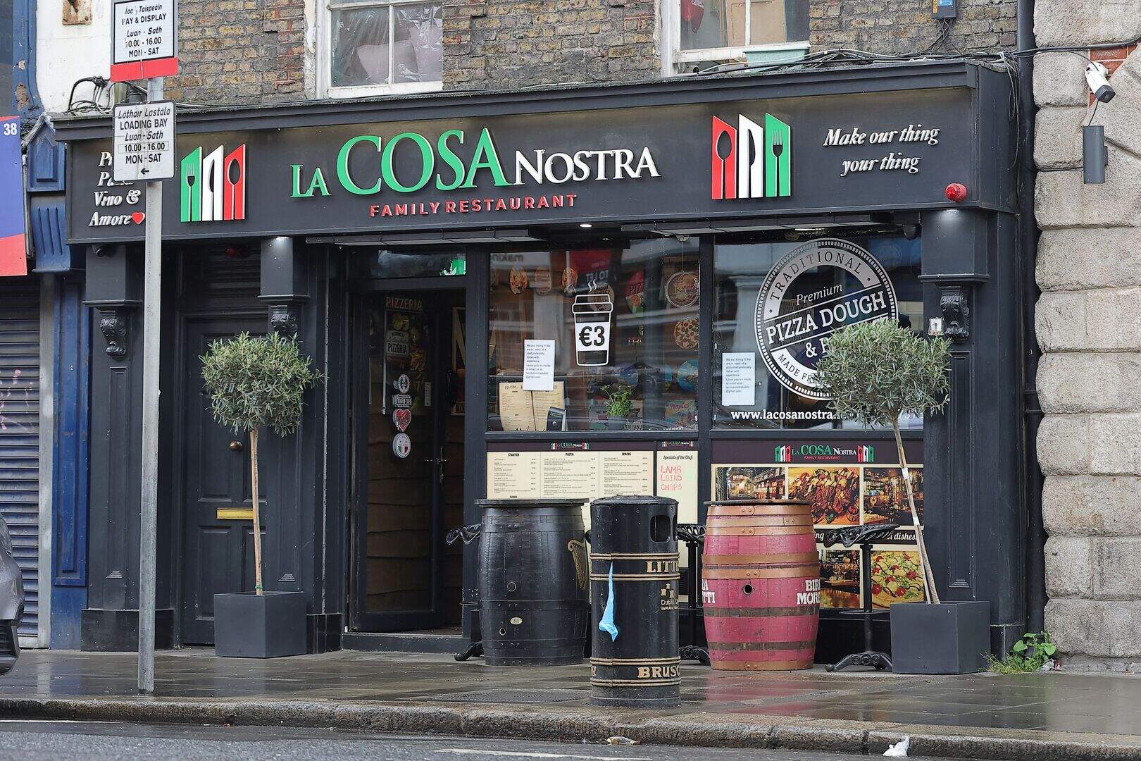 La Cosa Nostra storefront at 37 Thomas Street, Dublin — black facade with green-white-red Italian flag signage